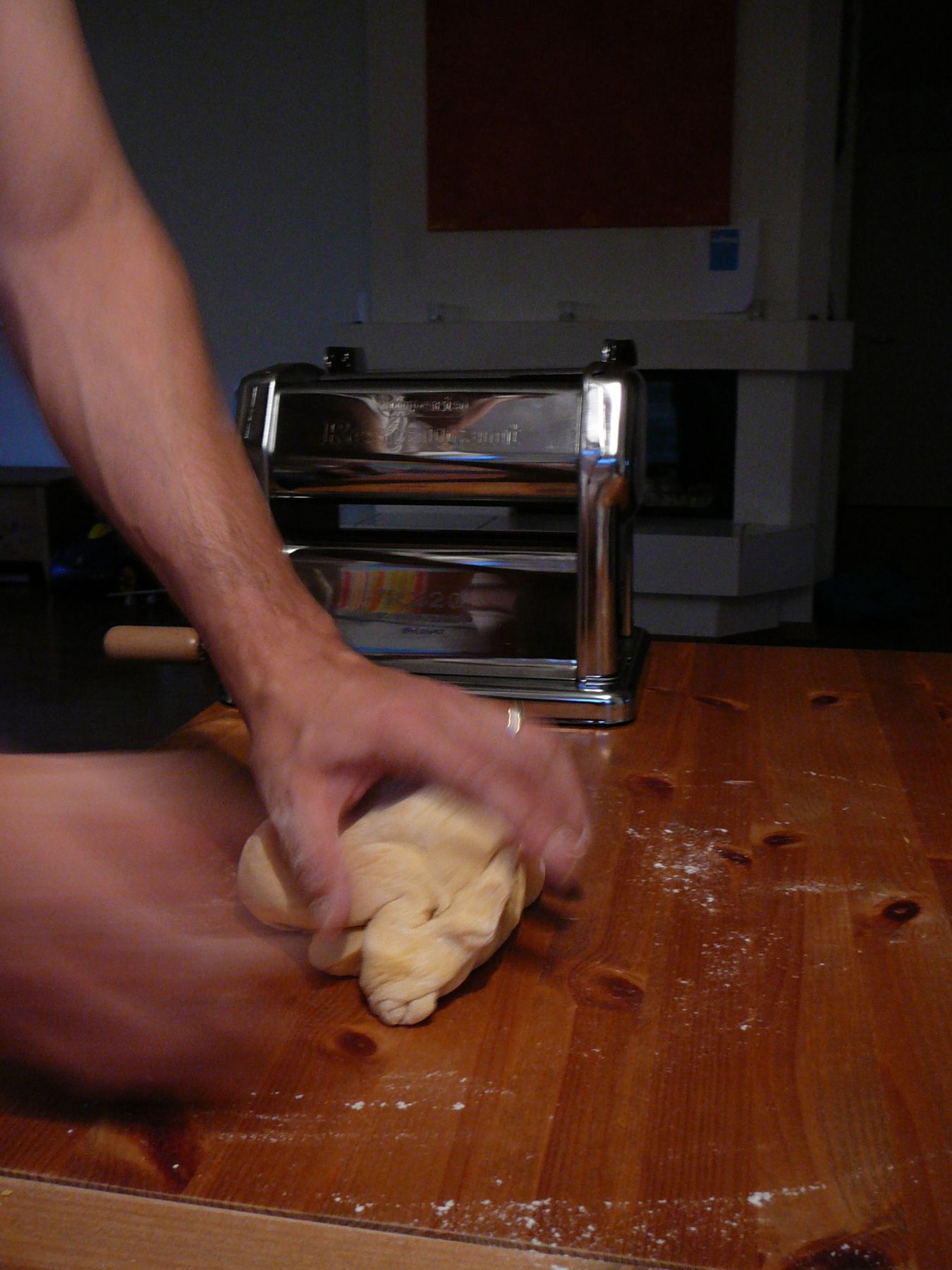 Hands kneading pasta dough